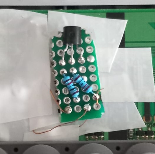 BC547 and two 10 kΩ resistors on perfboard wired to the keyboard PCB